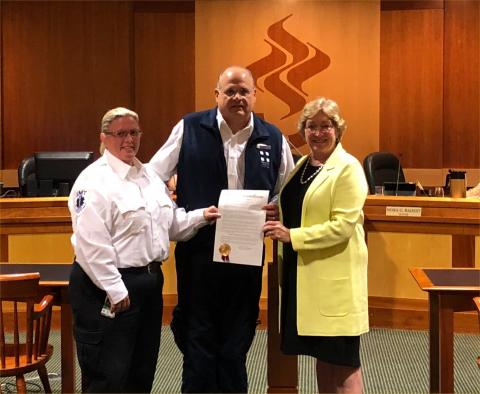 John Buscaino and Kari Phair accept the Proclamation from Mayor Radest (J. Staunton photo)